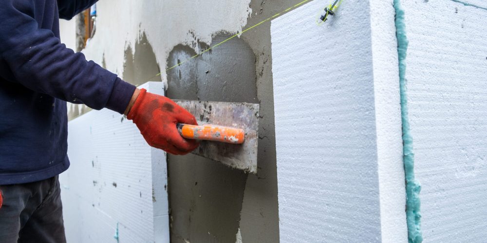 construction-worker-installing-styrofoam-insulatio-2026-01-07-02-13-45-utc