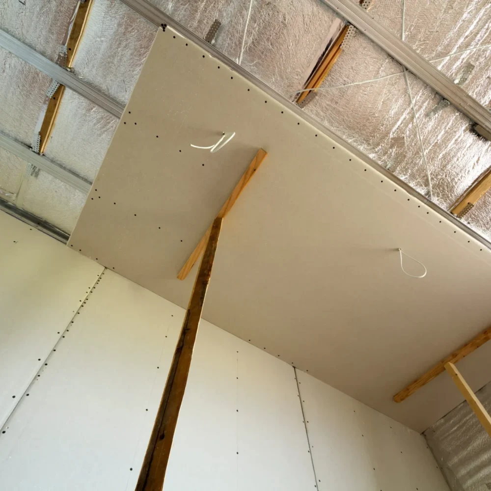 drywall-installation-with-wooden-supports-in-a-roo-2026-03-17-06-30-30-utc