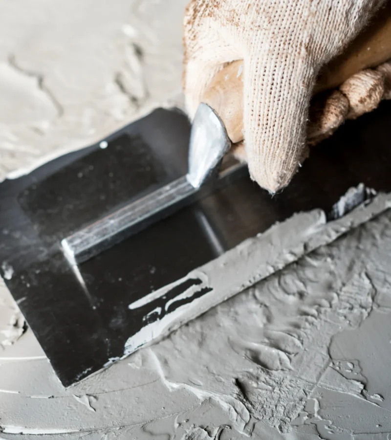 grey-paste-application-with-a-trowel-and-gloved-ha-2026-03-18-10-37-26-utc (1)