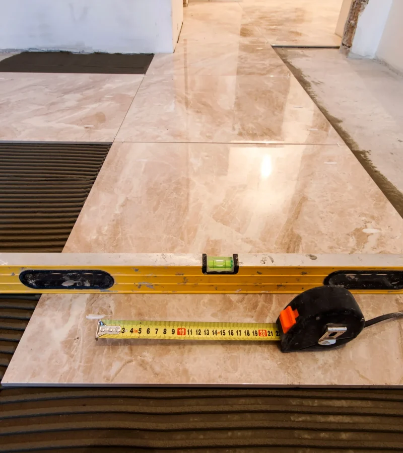 tile-installation-with-level-and-measuring-tape-2026-03-17-05-08-04-utc (1)